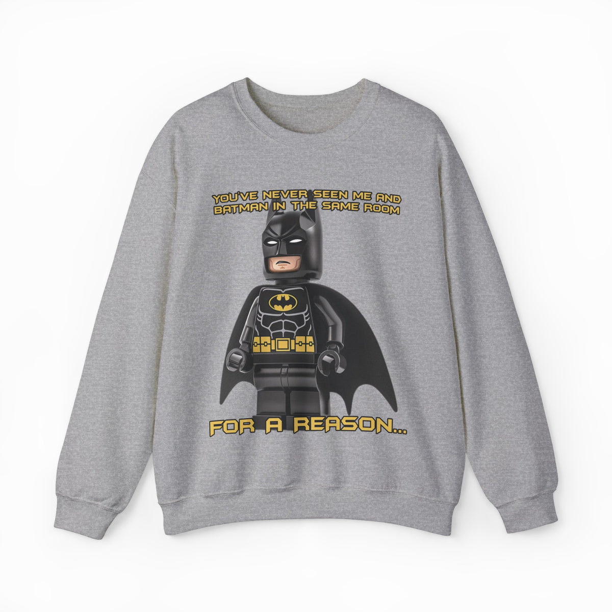 The "You've Never Seen Me And Batman In The Same Room For A Reason..." Crewneck features a gray LEGO Batman design with witty yellow text—perfect for fans seeking a fun, conversation-starting shirt.