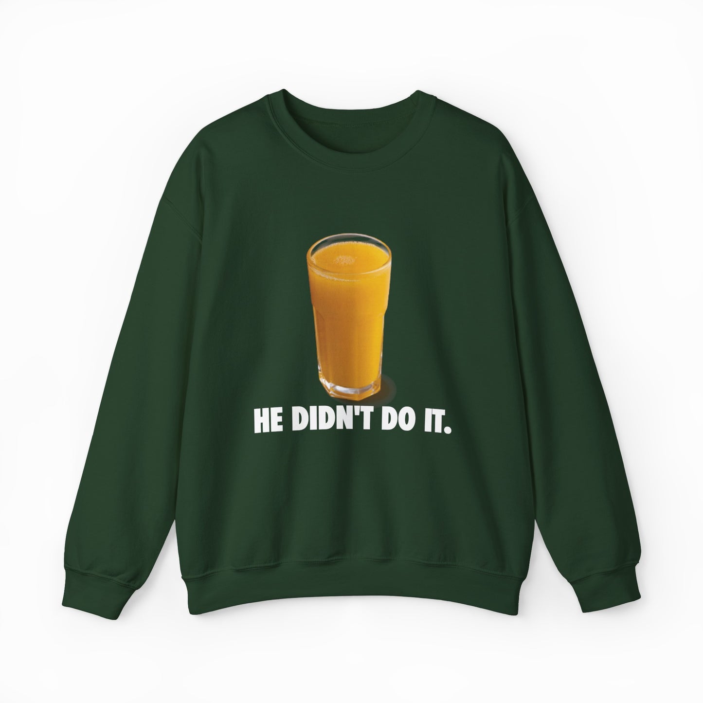 The He Didn't Do It Crewneck is a dark green sweatshirt featuring a full glass of orange juice above bold white text—ideal for fans of funny and Illegal Shirts with a clever twist.