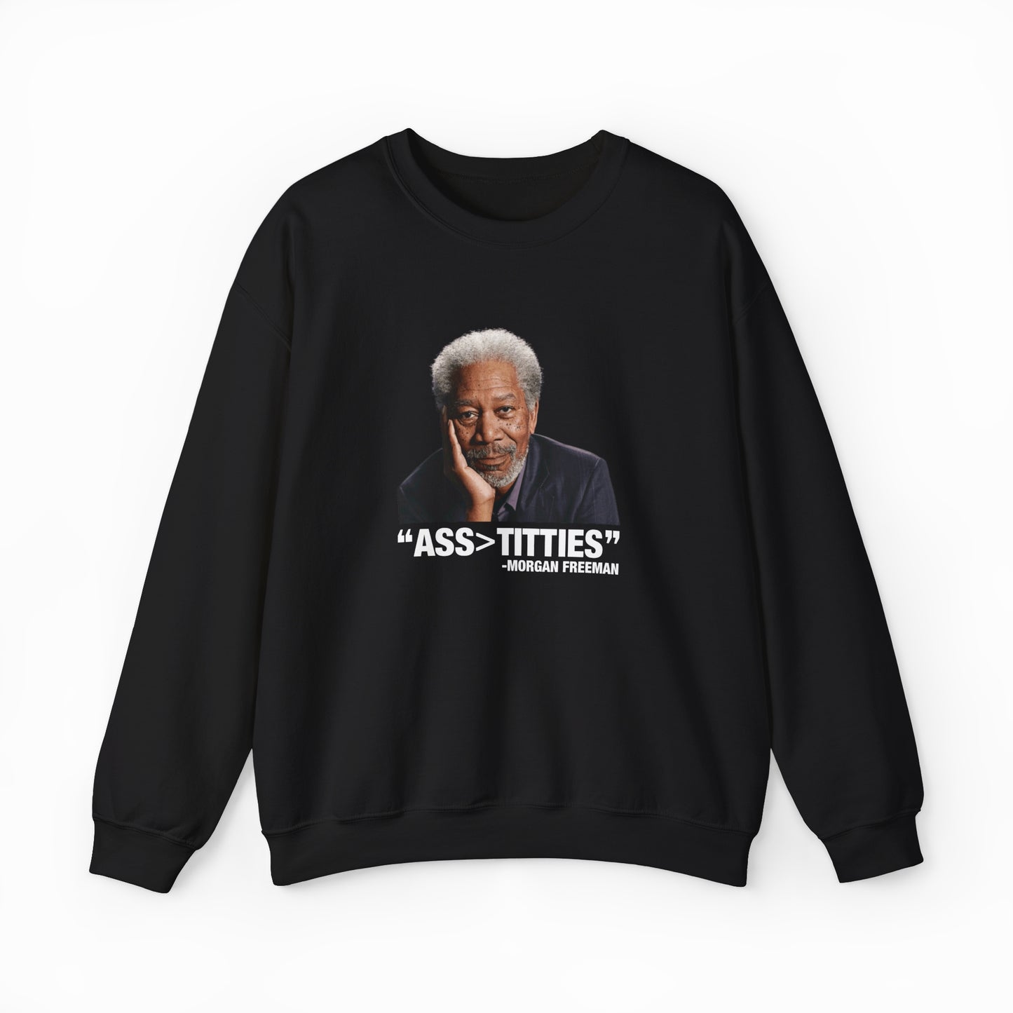 The Ass>Titties Crewneck is a black, medium-heavy sweatshirt showcasing a portrait of an older man with gray hair and a beard. Bold white text reads: ASS > TITTIES and “- Morgan Freeman.” From the iconic Illegal Shirts collection.