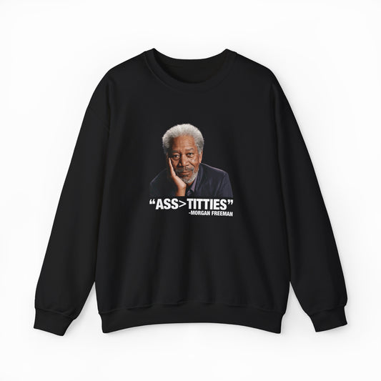 The Ass>Titties Crewneck is a black, medium-heavy sweatshirt showcasing a portrait of an older man with gray hair and a beard. Bold white text reads: ASS > TITTIES and “- Morgan Freeman.” From the iconic Illegal Shirts collection.