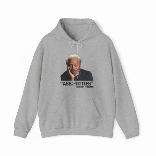 The Ass>Titties Hoodie is a gray sweatshirt with a photo of an older man with gray hair and a beard. Below, it reads: “ASS>TITTIES” - Morgan Freeman. Perfect for fans of bold, Illegal Shirts-inspired humor.