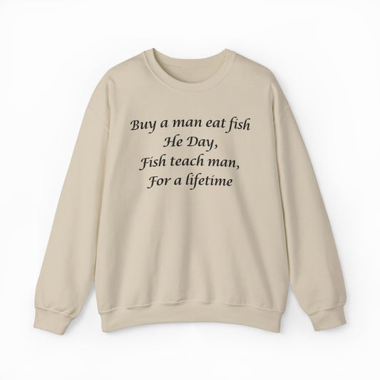 The "Buy A Man Eat Fish He Day, Fish Teach Man, For A Lifetime Crewneck" is a beige sweatshirt with black text, perfect for fans of funny shirts. Displayed on a plain white background.