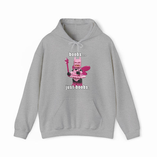The "Boobs... Just Boobs. Hoodie" is a gray cotton-polyester sweatshirt featuring a pink LEGO-inspired superhero with a wand and the playful phrase "boobs... just boobs" above and below. A quirky, fun addition to your Illegal Shirts collection.