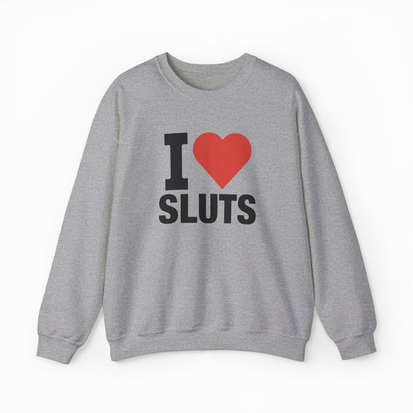The I Heart Sluts Crewneck from Illegal Shirts is a gray sweatshirt featuring "I Heart Sluts" in bold black text with a red heart on the front, made from cozy medium-heavy fabric.