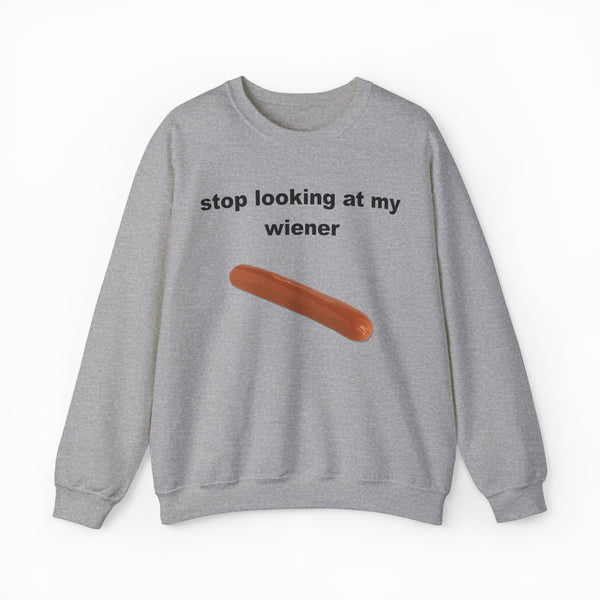 The Stop Looking At My Wiener Crewneck is a grey sweatshirt with a playful hot dog graphic—ideal for anyone who loves fun, eye-catching shirts.