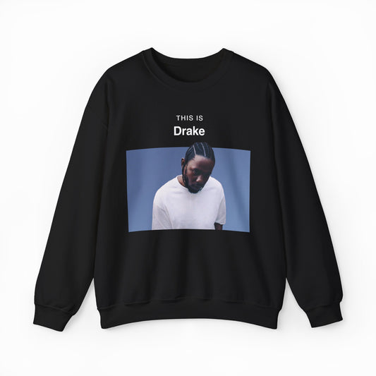 The This Is Drake Crewneck is a black sweatshirt with a photo of a man in a white shirt looking down and “THIS IS Drake” text above—ideal for fans seeking unique, funny shirts.