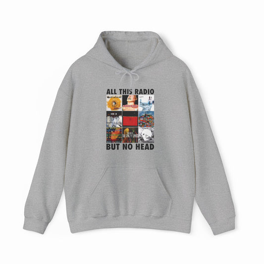 The All This Radio But No Head Hoodie from Illegal Shirts is gray, made with medium-heavy fabric, and features a grid of album covers with the phrase ALL THIS RADIO BUT NO HEAD above and below the graphics.
