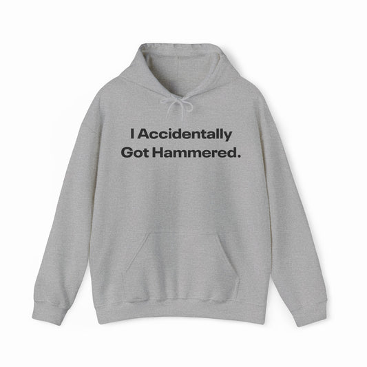 The I Accidentally Got Hammered. Hoodie from Illegal Shirts features bold black text on light gray, crafted from medium-heavy fabric with a front pocket and drawstrings for comfort and style.