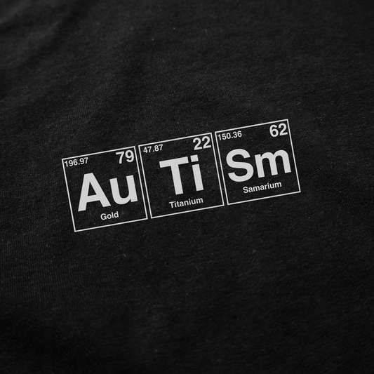 The image features "Autism" spelled with periodic table elements—Au, Ti, and Sm—showing their atomic numbers and weights on black, making this Autism Periodic Table T-Shirt a clever addition to your funny shirts collection.