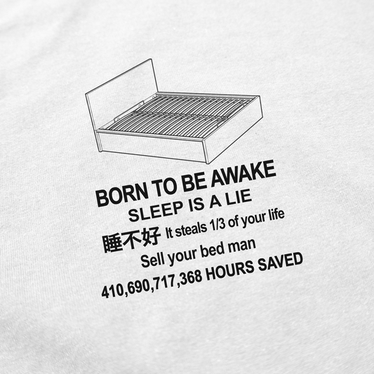 The Born To Be Awake T-Shirt features a bed outline above bold text: BORN TO BE AWAKE, SLEEP IS A LIE, 睡不好. Boasting 410,690,717,368 HOURS SAVED—sell your bed, man! Illegal Shirts never looked so bold.
