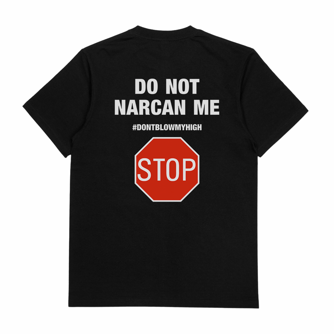 The Do Not Narcan Me T-Shirt (Backprint) is a black, 175 GSM tee made from ethically grown cotton. The back features white text—DO NOT NARCAN ME and #DONTBLOWMYHIGH—above a red stop sign graphic with STOP in white letters.