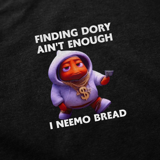 The Finding Dory Ain't Enough I Neemo Bread T-Shirt features a Nemo-like cartoon fish in a hoodie with cash and gold chain. Text says: "FINDING DORY AIN'T ENOUGH I NEEMO BREAD"—a funny shirt for fans of the movie!.