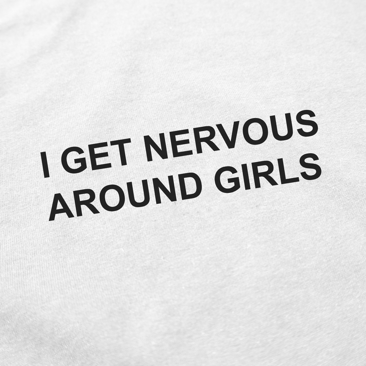 The I Get Nervous Around Girls T-Shirt is made from 100% cotton white fabric and features bold, all-caps black text that is slightly angled for a unique look.