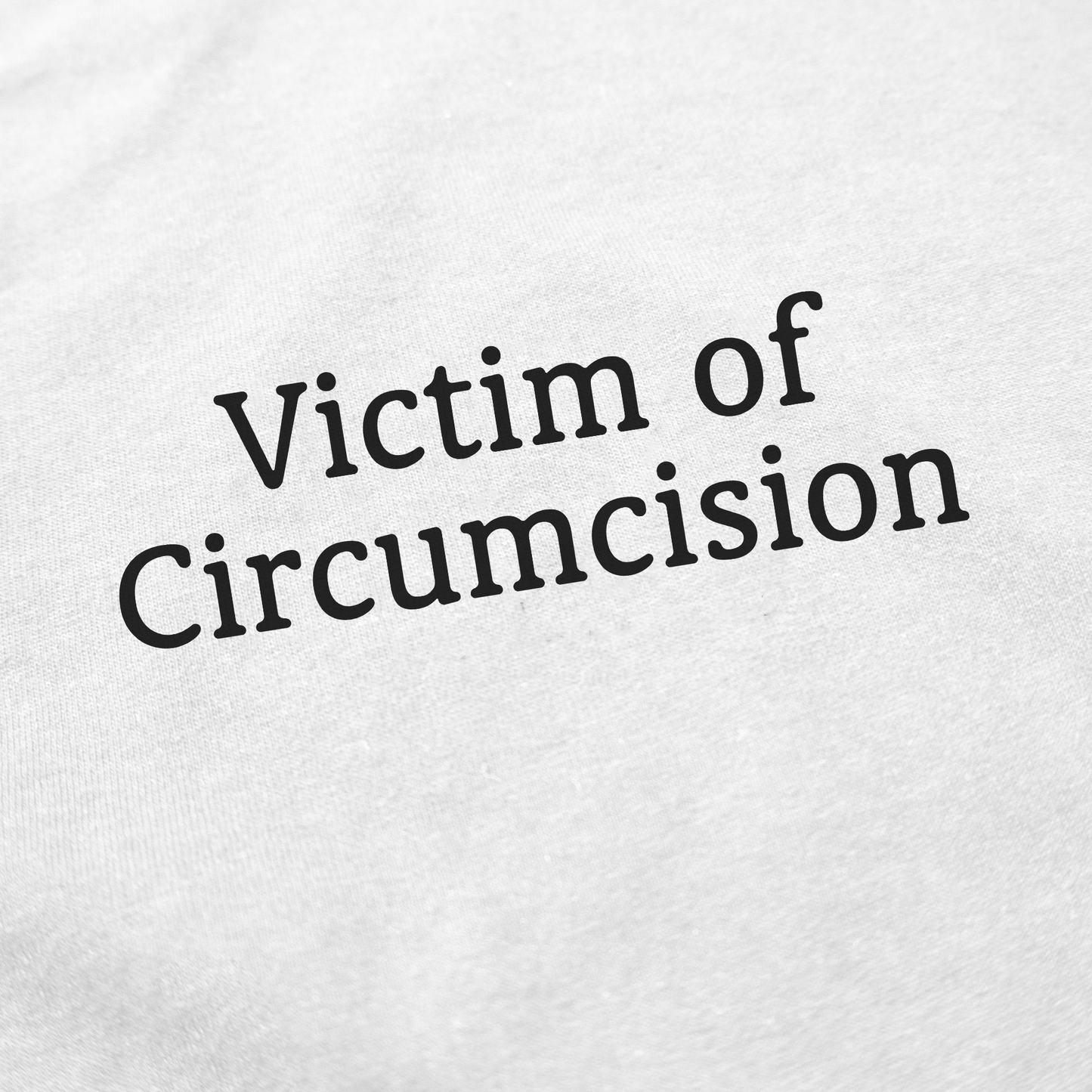 The Victim Of Circumcision T-Shirt features bold, curved black text reading "Victim of Circumcision" on white fabric—a funny, eye-catching shirt sure to spark conversations.