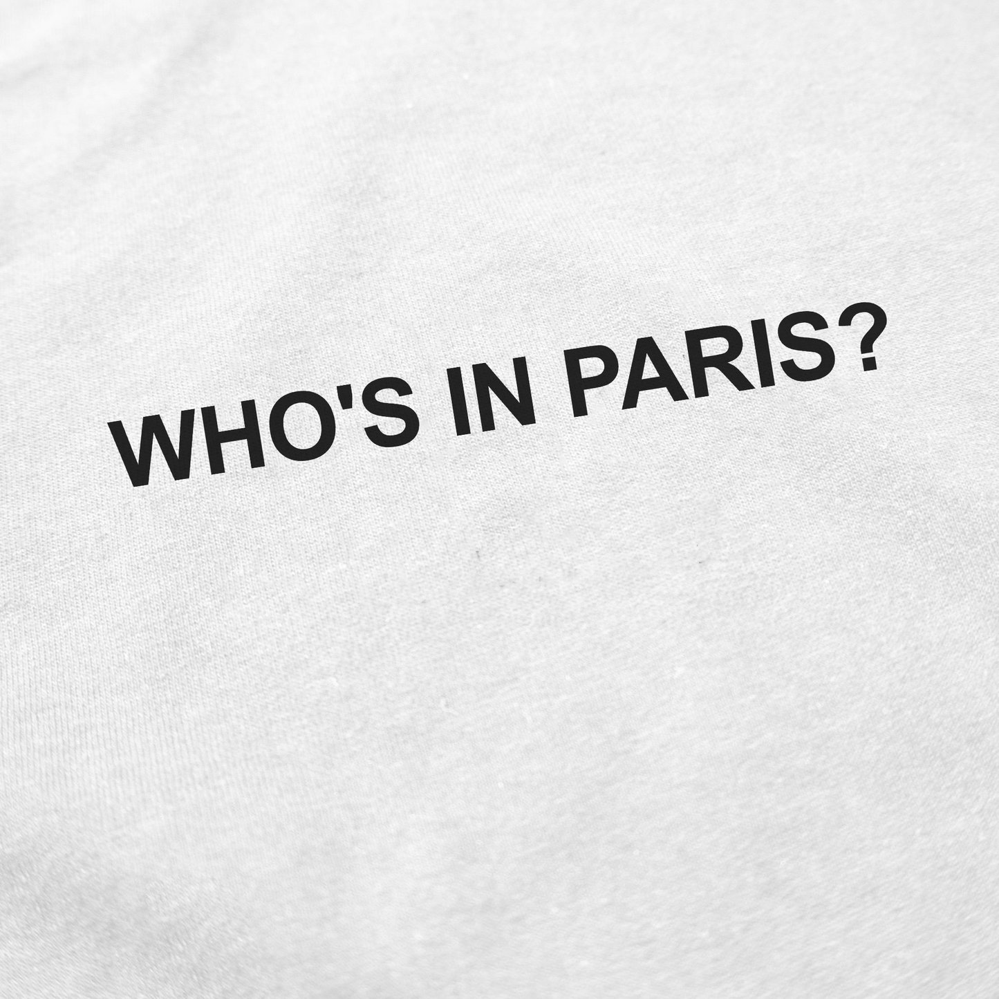 The Who's in Paris? T-Shirt features bold, black, uppercase text on white fabric—ideal for fans of funny shirts or anyone looking for a unique Who's in Paris? T-shirt.