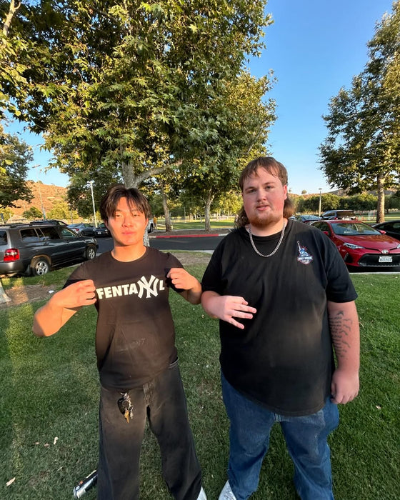 Customer in black statement tee