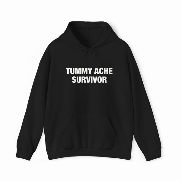 The Tummy Ache Survivor Hoodie is a black cotton-polyester sweatshirt with "TUMMY ACHE SURVIVOR" on the chest, front pocket, drawstring hood, and is part of our signature Illegal Shirts collection.