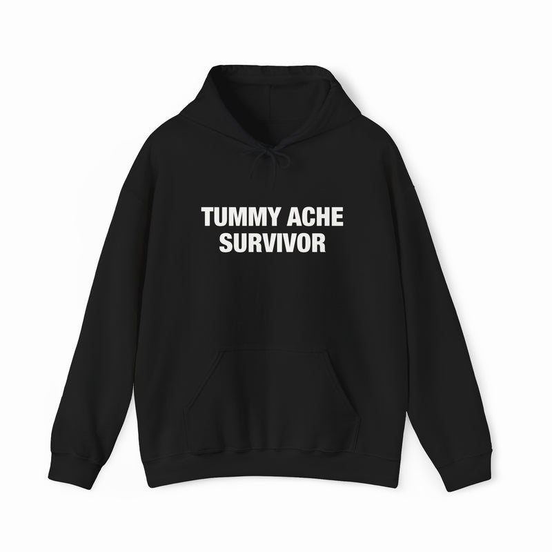 The Tummy Ache Survivor Hoodie is a black cotton-polyester sweatshirt with "TUMMY ACHE SURVIVOR" on the chest, front pocket, drawstring hood, and is part of our signature Illegal Shirts collection.