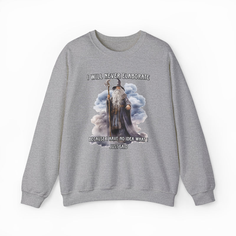The "I Will Never Elaborate Crewneck" is a gray, medium-heavy sweatshirt featuring a wizard illustration and bold phrase. Part of Illegal Shirts, it’s perfect for anyone who loves humor and mystery in their style.