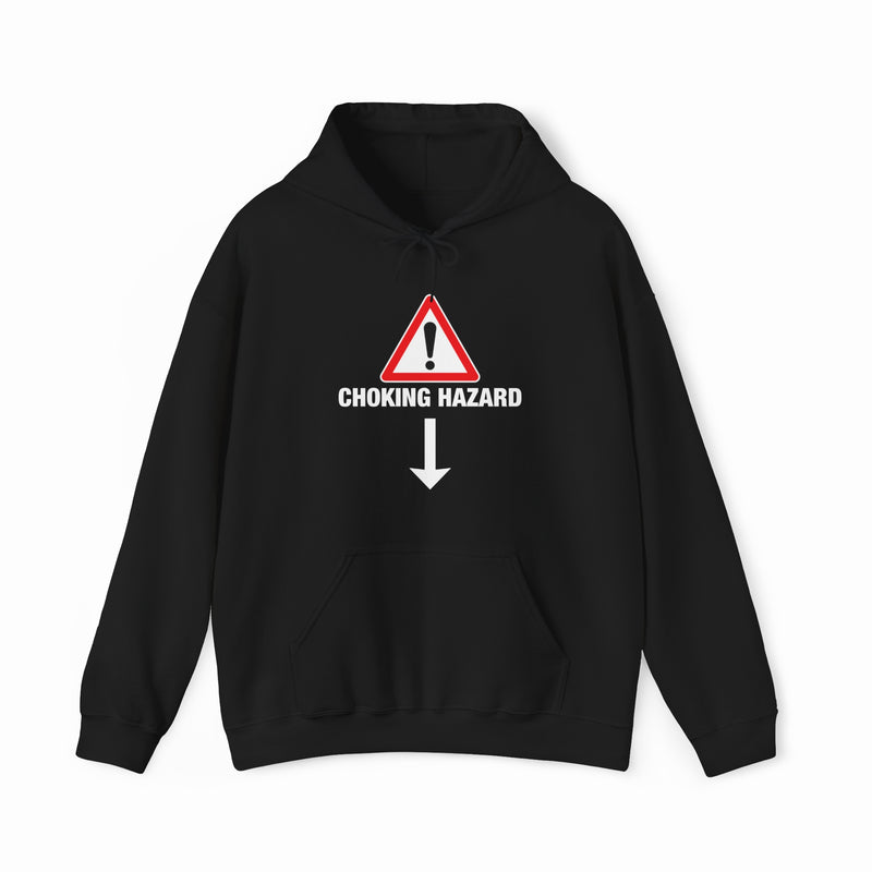 The Choking Hazard Hoodie by Illegal Shirts is black, made from medium-heavy fabric, and features a front warning sign with an exclamation mark above “CHOKING HAZARD” and a downward-pointing arrow.