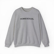 The Homiesexual Crewneck by Illegal Shirts is a light gray medium-heavy sweatshirt with "HOMIESEXUAL" in bold black letters across the chest, shown laid flat on a white background.