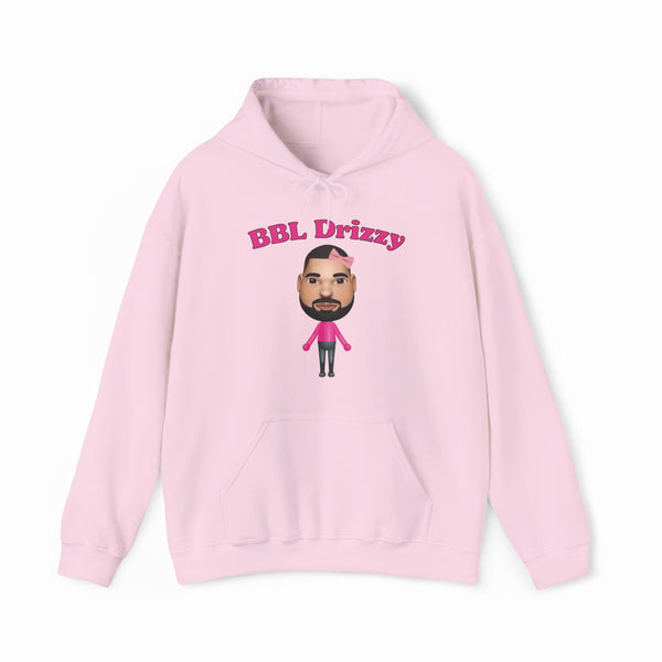 The BBL Drizzy Hoodie is a light pink cotton-polyester blend featuring bold pink "BBL Drizzy" text above a cartoon with a beard, short hair, and a pink shirt with black pants. Part of our exclusive Illegal Shirts collection.