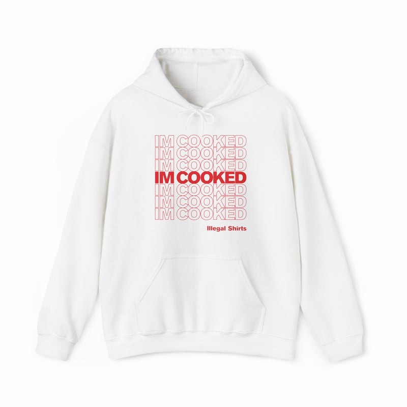 The I'm Cooked Hoodie is white, with bold red "I’m Cooked" text in a grid, centered and bolded. “Illegal Shirts” appears below in smaller red letters. Made from medium-heavy fabric with a front pocket and drawstring hood.