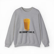 The He Didn't Do It Crewneck features a gray sweatshirt with a glass of orange juice and “HE DIDN’T DO IT.” text—ideal for fans of funny shirts and playful Illegal Shirts style.