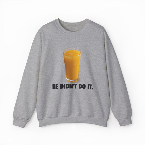 The He Didn't Do It Crewneck features a gray sweatshirt with a glass of orange juice and “HE DIDN’T DO IT.” text—ideal for fans of funny shirts and playful Illegal Shirts style.