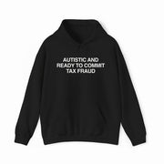 The "Autistic And Ready To Commit Tax Fraud Hoodie" is a black hoodie with bold white text—ideal for anyone who enjoys funny, rebellious apparel.