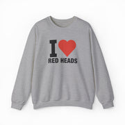 The I Heart Red Heads Crewneck is a gray cotton-polyester sweatshirt with long sleeves, a crew neck, and "I Heart Red Heads" with a red heart on the front. Part of the playful Illegal Shirts collection.