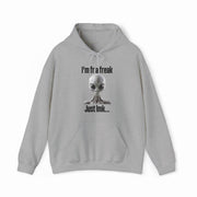 The "I'm FR A Freak Just LMK... Hoodie" by Illegal Shirts is a gray hoodie featuring a wide-eyed alien graphic and bold black lettering on medium-heavy fabric for lasting comfort and style.