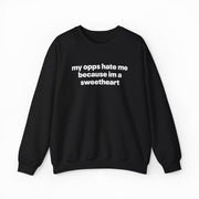 The My Opps Hate Me Because I'm A Sweetheart Crewneck is a black sweatshirt with bold white text on the front—ideal for anyone who loves statement apparel.