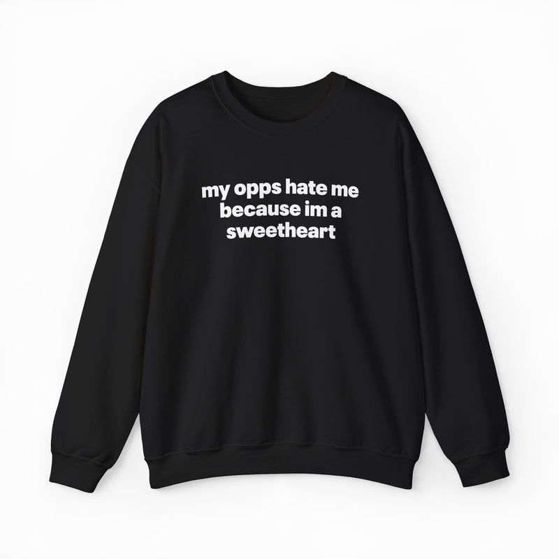 The My Opps Hate Me Because I'm A Sweetheart Crewneck is a black sweatshirt with bold white text on the front—ideal for anyone who loves statement apparel.