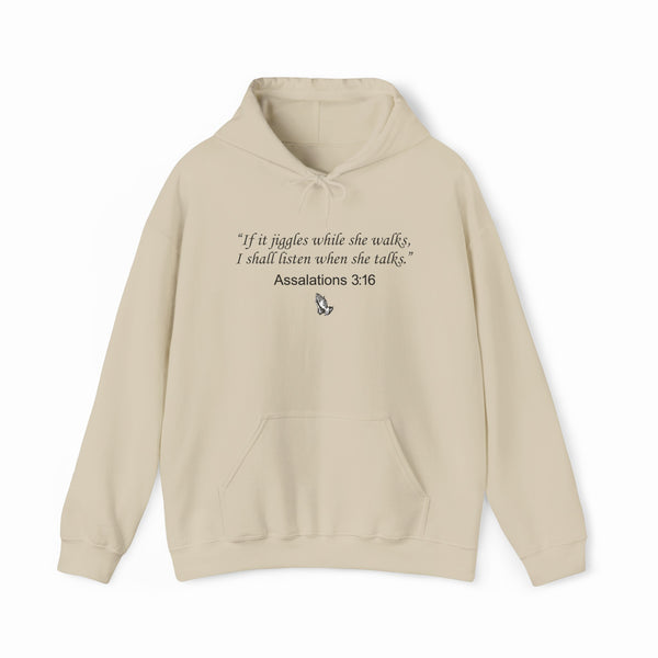 The Assalations 3:16 Hoodie is a beige, medium-heavy hooded sweatshirt featuring bold black text—“If it jiggles while she walks, I shall listen when she talks. Assalations 3:16”—plus praying hands artwork. A standout piece from Illegal Shirts.