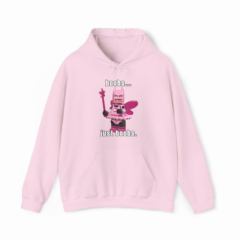 The Boobs... Just Boobs. Hoodie features a light pink LEGO-inspired armored figure with bold chest details and the phrase "boobs... just boobs" above and below. This cotton-polyester sweatshirt is an iconic Illegal Shirts design.