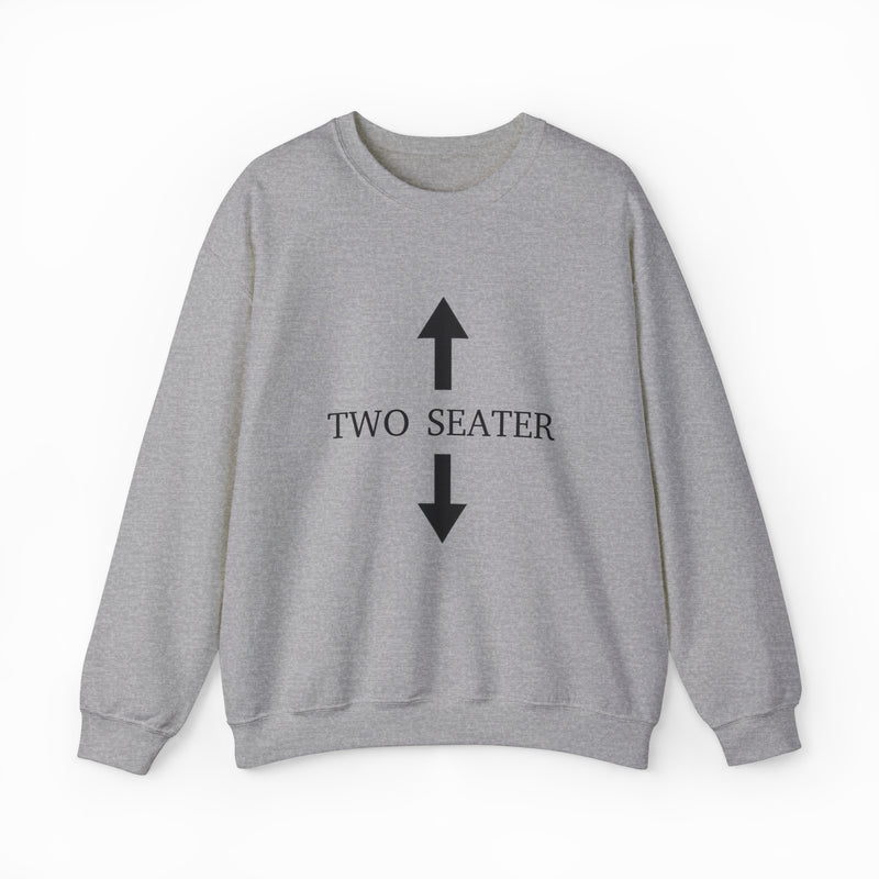The Two Seater Crewneck is a gray sweatshirt made from medium-heavy fabric, featuring two large black arrows pointing up and down with "TWO SEATER" in bold black capital letters between the arrows on the front.