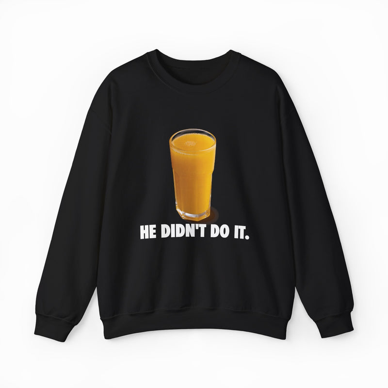 The He Didn't Do It Crewneck is a black sweatshirt with a glass of orange juice over bold white "HE DIDNT DO IT" text—ideal for fans of Illegal Shirts or anyone who loves funny statement shirts.