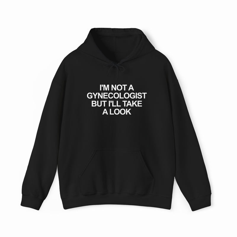 The "I'm Not a Gynecologist but I'll Take a Look" Hoodie features the bold white phrase on black—this funny and must-have hoodie is from Illegal Shirts.