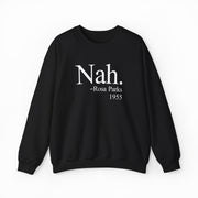 The Nah Crewneck is a black sweatshirt with white text—“Nah. -Rosa Parks 1955”—centered on the front, crafted from medium-heavy fabric for standout comfort and statement style among Illegal Shirts.