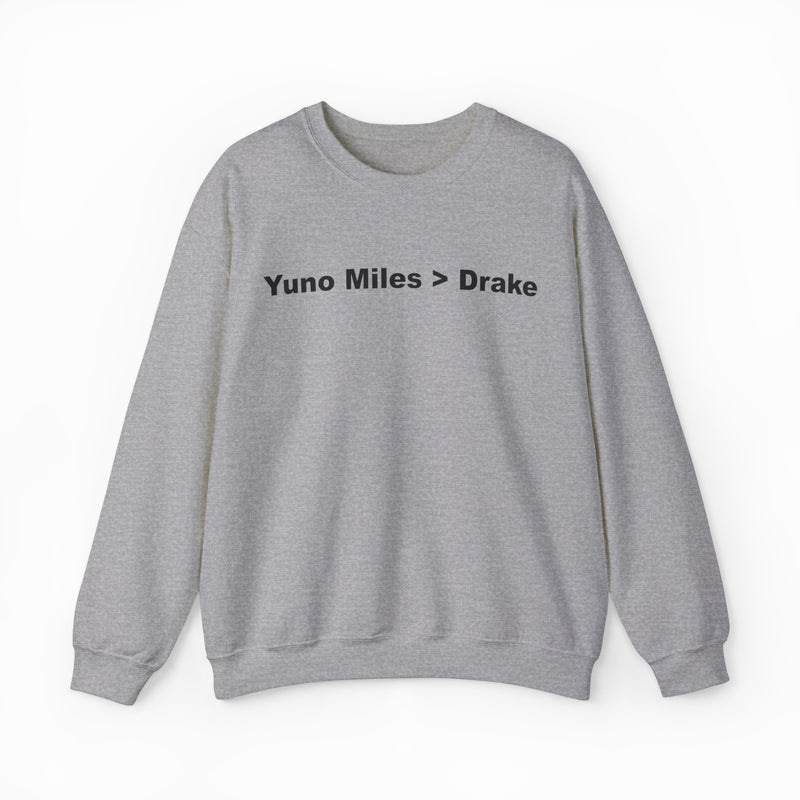 The Yuno Miles > Drake Crewneck is a gray sweatshirt featuring "Yuno Miles > Drake" in bold black text—a perfect pick for fans of funny shirts and the iconic crewneck style.