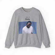 The This Is Drake Crewneck is a gray sweatshirt featuring a photo of a man in a white shirt looking down, with “THIS IS Drake” printed above—a stylish nod to iconic and funny shirts.