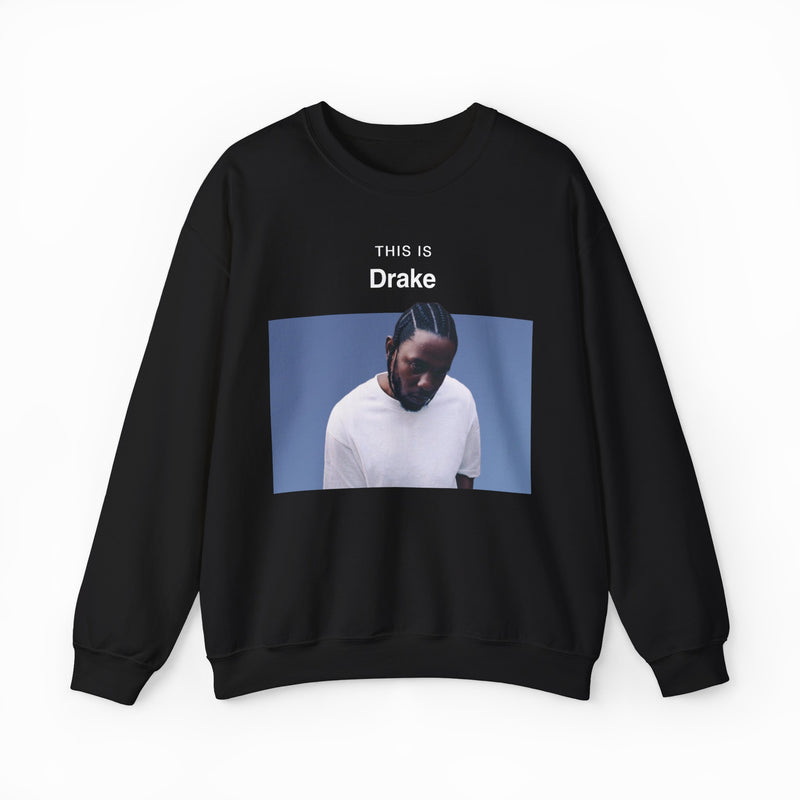 The This Is Drake Crewneck is a black sweatshirt with a photo of a man in a white shirt looking down and “THIS IS Drake” text above—ideal for fans seeking unique, funny shirts.