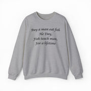The Buy A Man Eat Fish He Day, Fish Teach Man, For A Lifetime Crewneck is a gray sweatshirt with this humorous black script across the chest—ideal for funny shirt lovers.