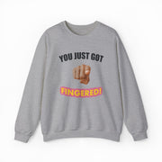 The You Just Got Fingered! Crewneck is a gray sweatshirt with "YOU JUST GOT" above a pointing hand graphic and bold pink and yellow "FINGERED!"—a playful, quirky pick for fans of funny or cheeky shirts.