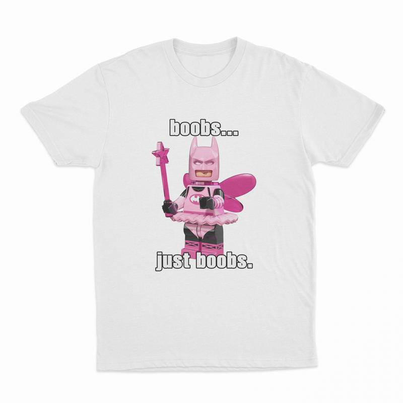 The Boobs... Just Boobs. T-Shirt features a pink LEGO-style bat-costumed figure with a wand and tutu, plus "boobs... just boobs." text—an amusing shirt for anyone who loves quirky and playful designs.