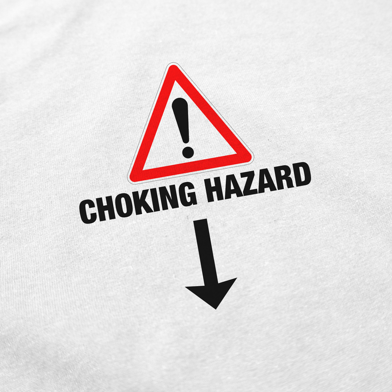 The Choking Hazard T-Shirt is made from ethically grown 175 GSM cotton and features a white background with a red triangle, bold CHOKING HAZARD text, an exclamation mark, and a large black downward arrow.