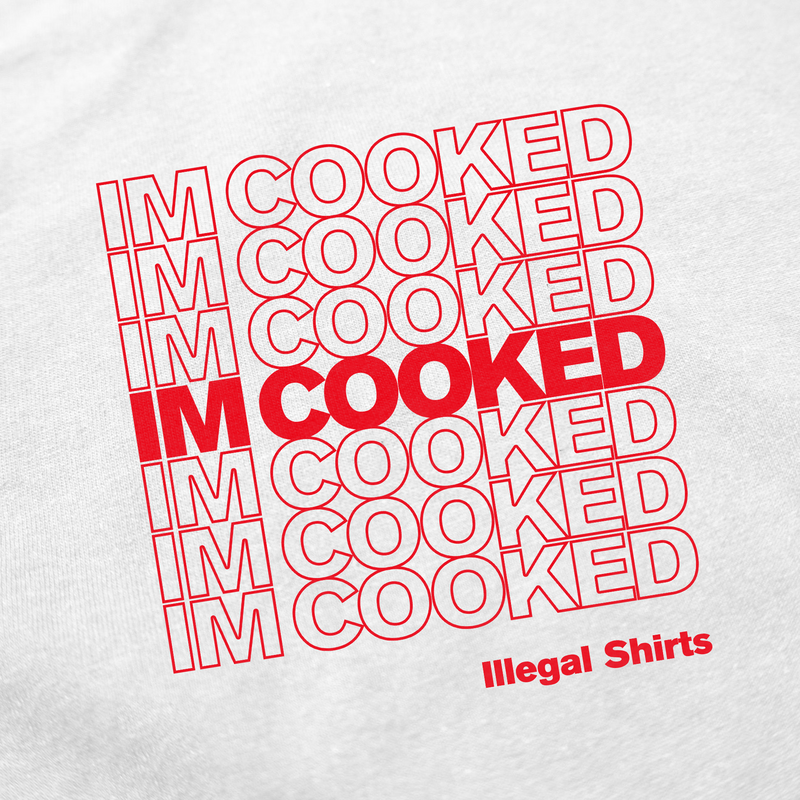 The I'm Cooked T-Shirt features white fabric with a bold red "I’M COOKED" slogan in the center, repeated text pattern, and "Illegal Shirts" printed in red at the bottom right—ideal for fans of funny or iconic tees.