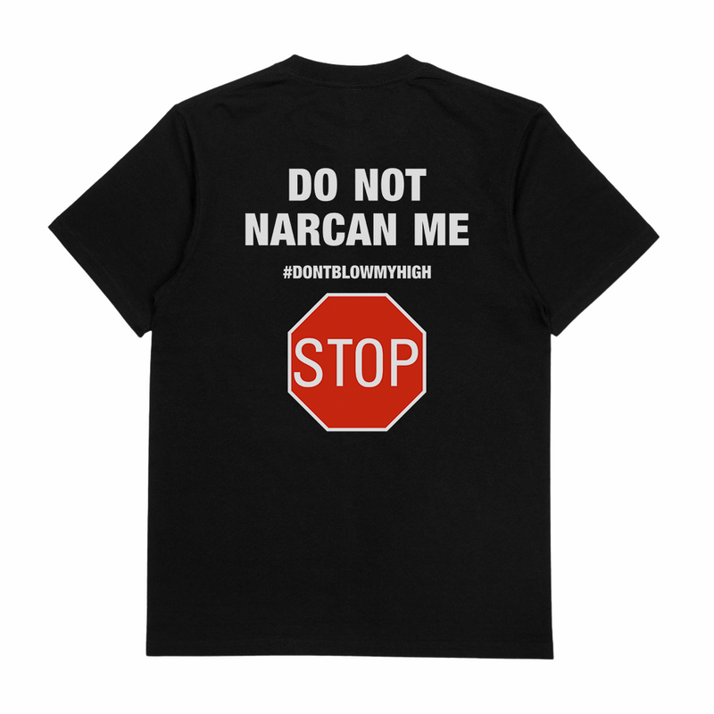 The Do Not Narcan Me T-Shirt (Backprint) is a black, 175 GSM tee made from ethically grown cotton. The back features white text—DO NOT NARCAN ME and #DONTBLOWMYHIGH—above a red stop sign graphic with STOP in white letters.