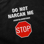 The Do Not Narcan Me T-Shirt is a black tee made from ethically grown cotton, featuring white "DO NOT NARCAN ME" and #DONTBLOWMYHIGH text above a red stop sign graphic with bold STOP in white.